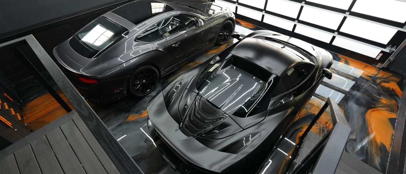 Metallic resin garage floor with supercars